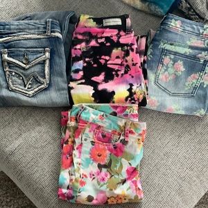 Four pairs fashionable young girls jeans